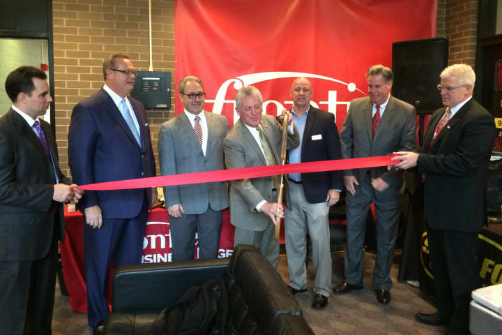 Norwalk Mayor Harry Rilling joins Frontier Communications for its ribbon-cutting at 2 Washington St. See story for photo IDs.