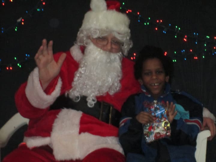 Santa Claus and a young boy at the Ossining Community Center.