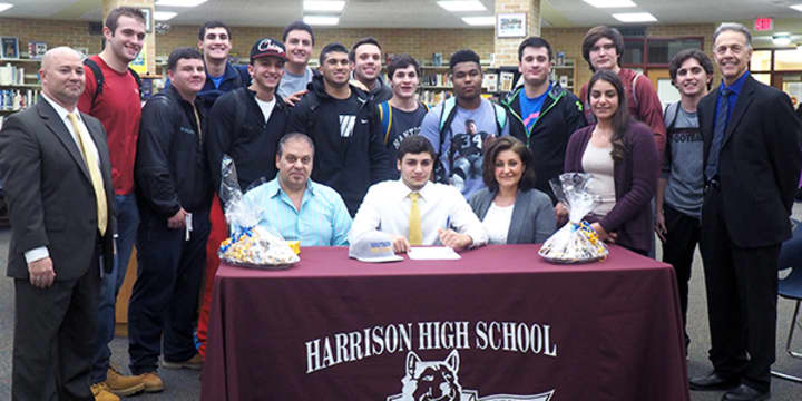 Sal LoMedico of Harrison High School (center of table) will play lacrosse for Southern New Hampshire University in 2015.