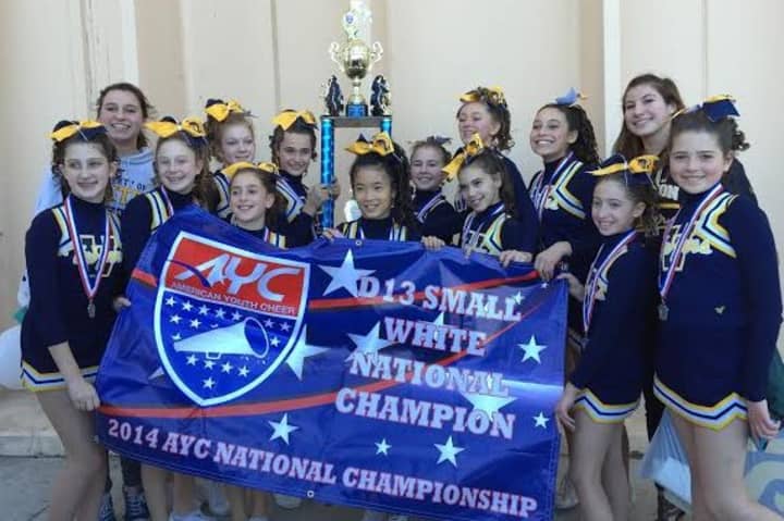 The Weston Trojan cheerleaders celebrate after winning the American Youth Football national championship.