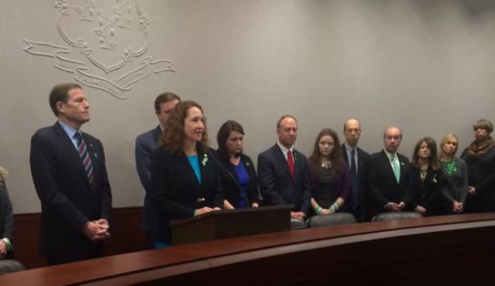 Representative Esty joining other officials to end gun violence.