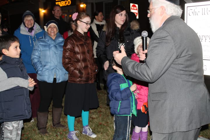 Rabbi Yehoshua S. Hecht, of Beth Israel Synagogue, speaks to a group of children about the message of Hanukkah in Westport.