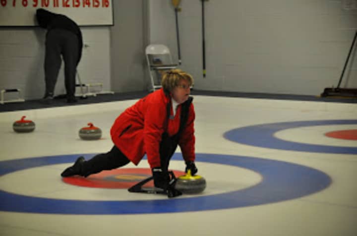 Members of the Nutmeg Curling Club hit the ice. 