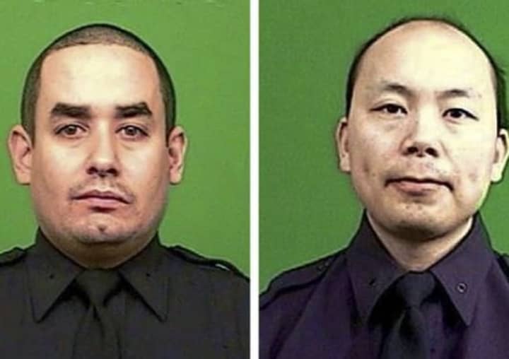 Slain NYPD officers Rafael Ramos and Wenjian Liu.