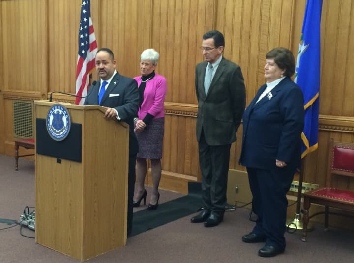 State Sen. Andres Ayala will be the new DMV commissioner. He was appointed by Gov. Dannel Malloy, who is accompanied by Lt. Gov. Nancy Wyman and current DMV Commission Melody Currey.