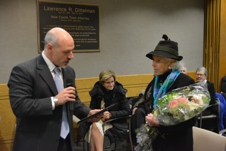 New Castle Supervisor Rob Greenstein, left, reads a plaque in honor of Henriette Suhr.