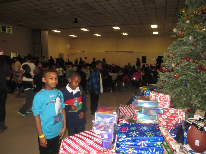 White Plains children check out the presents before they were handed out by Batty&#x27;s Kids on Christmas Eve.