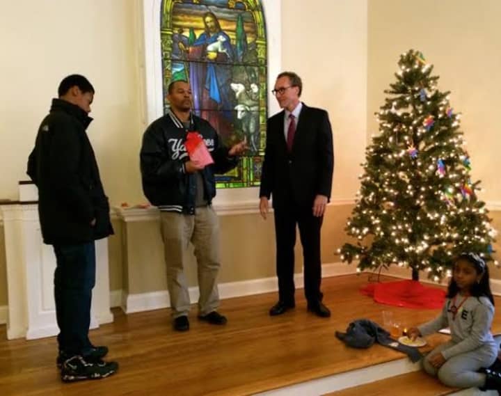 Greenville Community Church delivers gifts to the Coachman Family Center. 
L-R Cornel Fisher of Greenville Church, Ivan Smith, Youth Service Coordinator of Coachman Family Services and Edward Schreur, Minister of Greenville Community Church.