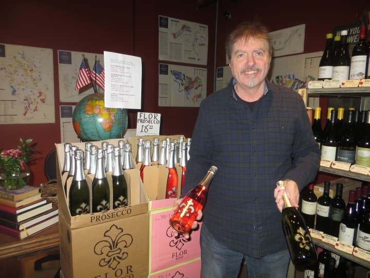 A salesman displays Tarry Wine&#x27;s Flor Rose and non-rose Prosecco.