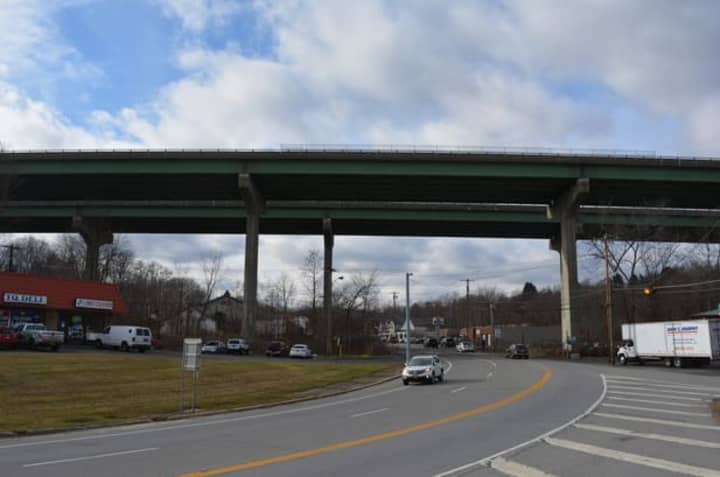 Officials have identified the woman who jumped from an I-84 overpass on Tuesday. 