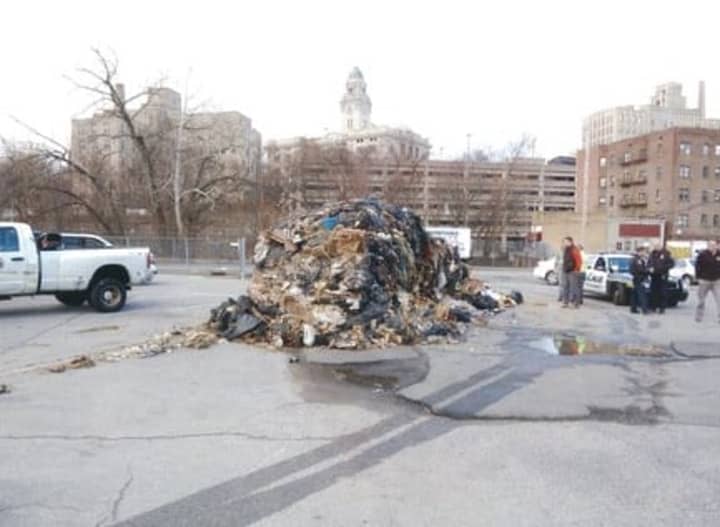 Yonkers police officers charged a man with illegal dumping in a local parking lot. 