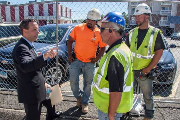State Sen. Bob Duff talks with workers in September at the construction kick-off of a new mixed-used housing and retail development at 65 Wall St. in Norwalk.