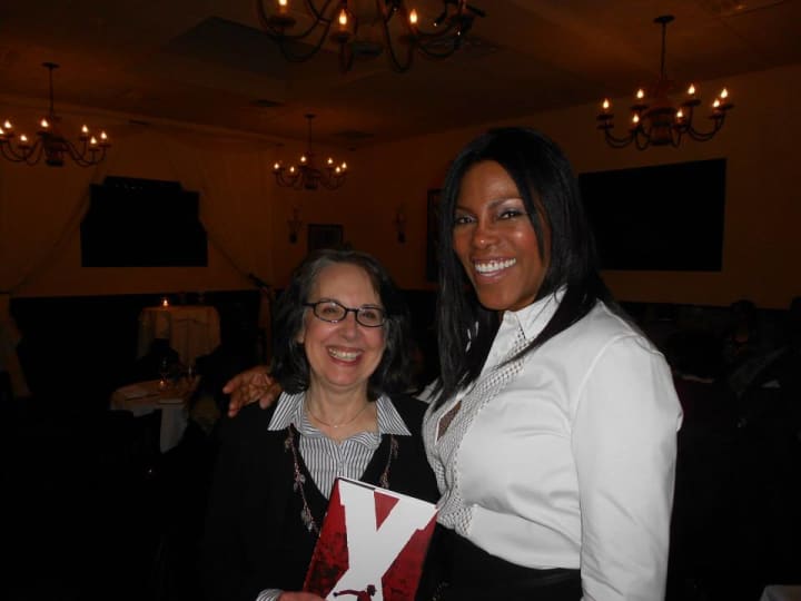 Francine Lucidon, owner of The Voracious Reader, left, with author Ilyasah Al-Shabazz.