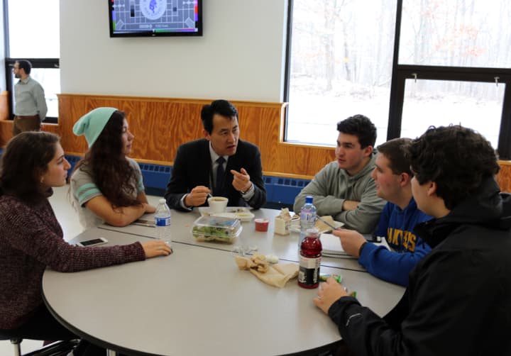 New Walter Panas High School Principal Keith Yi talks with students at the school in Cortlandt, N.Y.