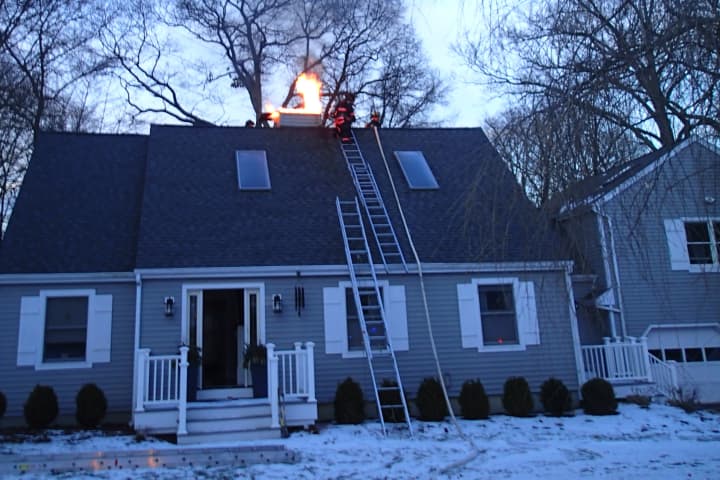 Westport firefighters respond to a chimney fire on Jackie Lane on Sunday.