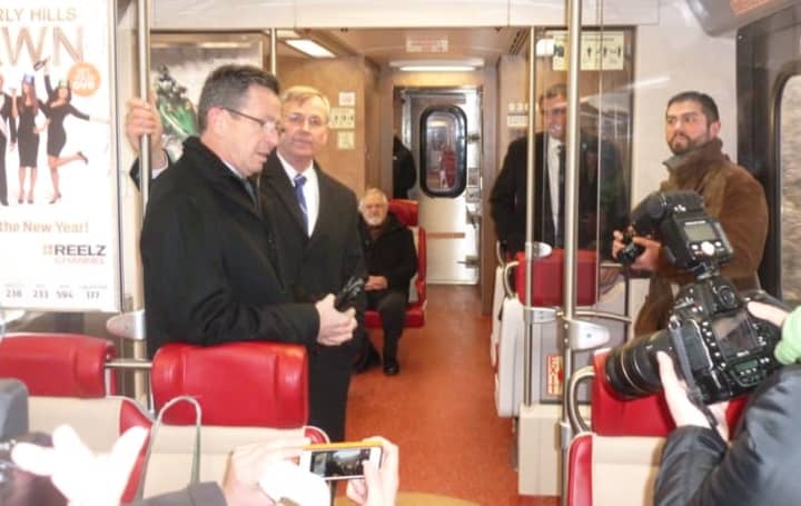 Gov. Dannel P. Malloy speaks while riding the train from Stamford&#x27;s Springdale station to New Canaan. Malloy announced new M-8 cars have begun operating on the New Canaan Branch.