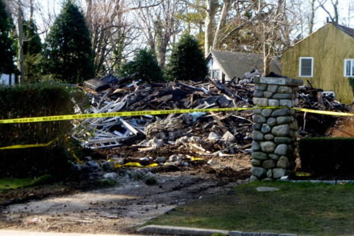 Debris from a house fire that killed five people on Christmas Day in 2011 may have been destroyed too quickly to allow further investigation, fire officials acknowledged in court depositions, according to the Hartford Courant.