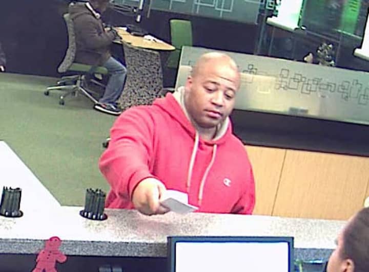 New York State Police need help identifying the man pictured, who is wanted for questioning regarding a bank fraud case. 