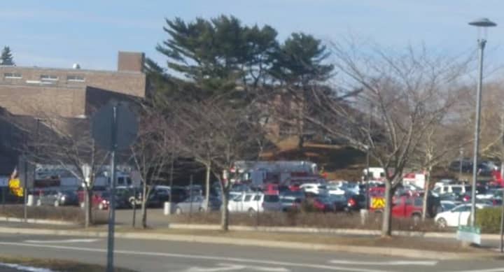 Four fire trucks arrive at the scene at Fairfield Ludlowe High School on Thursday. 