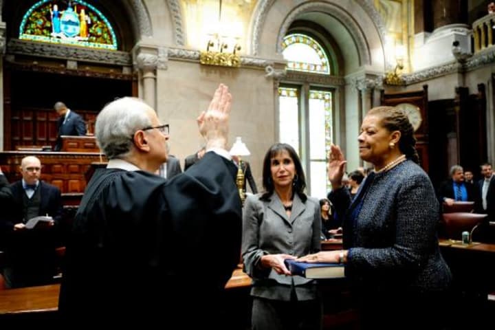 Senator Ruth Hassell-Thompson being sworn into office by Judge Jonathan Lippman, Chief Judge of the State of New York. She will leave the Senate in July.