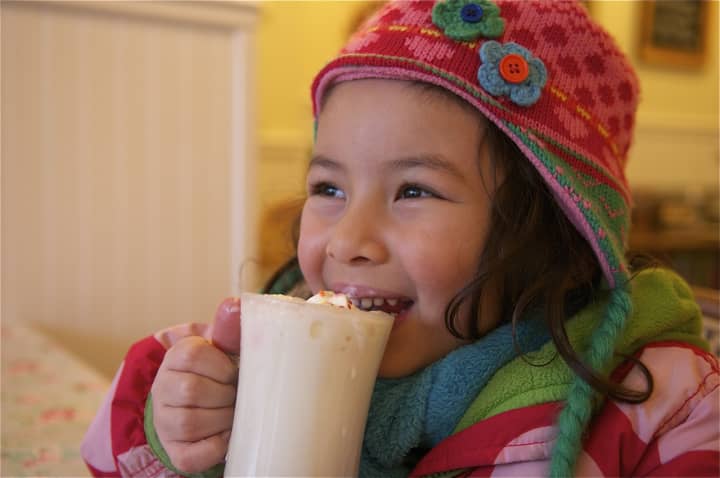 Kona Lahire, 5, of Mamaroneck, samples the white chocolate hot chocolate at Larchmont&#x27;s Voracious Reader.