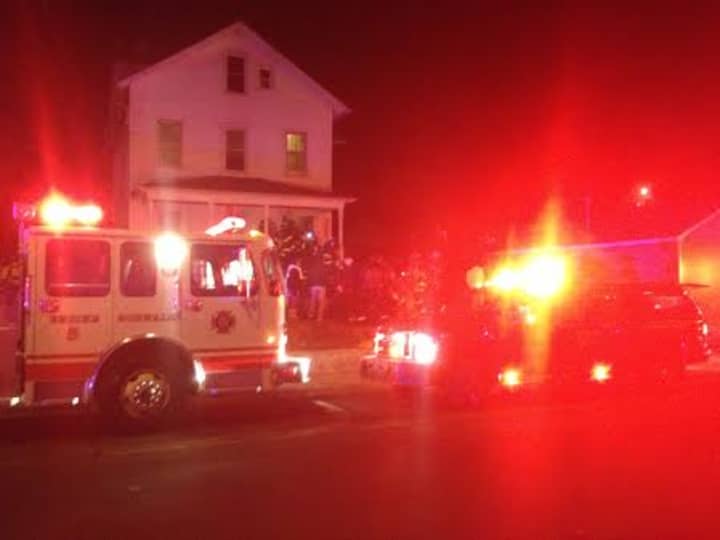 Norwalk fire officials arrive on the scene of a carbon monoxide leak in a Woodward Avenue home Saturday. 