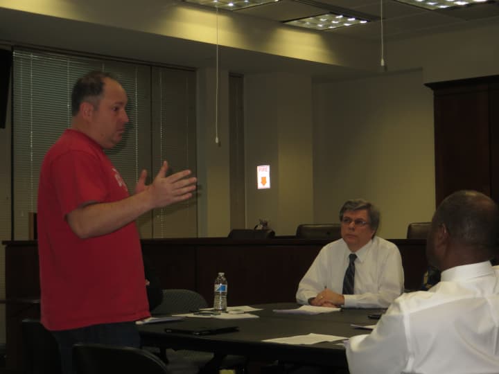 Greenburgh resident David DePietto, left, voices his concerns Tuesday to the Town Council about the proliferation of new massage parlors in the Edgemont section of town.