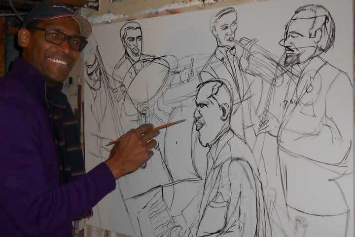 Artist Alvin Clayton at work in his home studio.