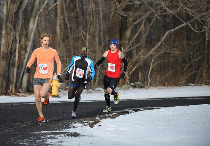 Runners race in the Boston Buildup 15k  last January in Ridgefield.