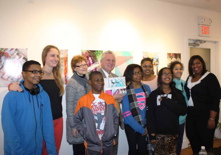 NHA student artists pose with teacher Lillie Fortino, Silvermine Educational Outreach Director Sophia Gevas, Mayor Rilling, and NHA After-School Program Director Wendy Gerbier (far right) at an exhibition of their work at the Silvermine Arts Center. 