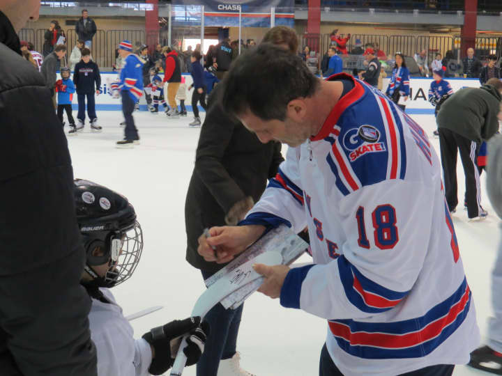 Mike Hartman signing autographs for kids in Rye.