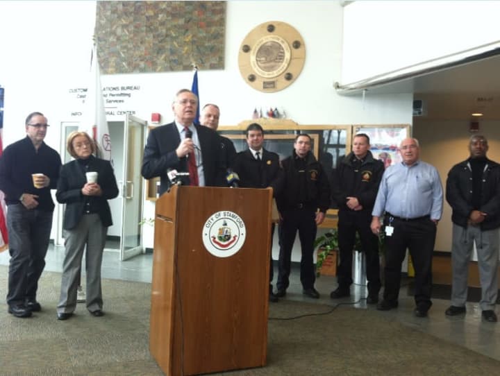 Mayor David Martin speaks Monday about the city&#x27;s response to the blizzard as other officials look on.