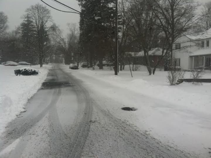 The roads in Stamford are covered with snow and slush on Tuesday morning. 