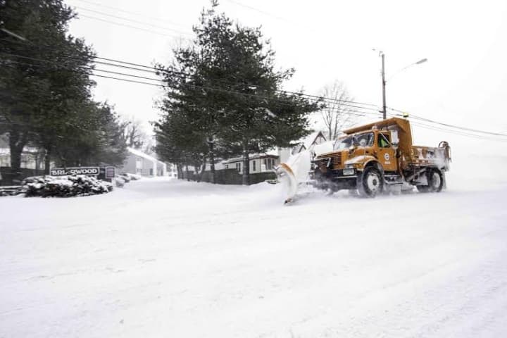 A plow clears a road in Bridgeport on Tuesday.