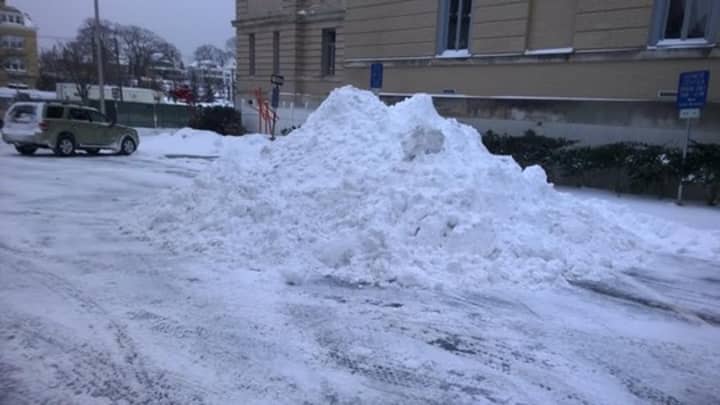 Snow piles up during the plowing operations Tuesday morning in Greenwich. 