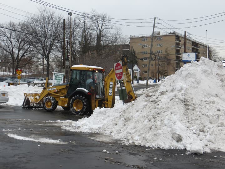 A bulldozer was needed to clear snow Thursday at the Harrison Shopping Center.
