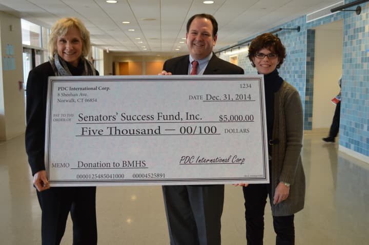 Norwalk resident and local business owner Neal Konstantin of PDC International, donates a $5,000 grant to help establish a college resource center at Brien McMahon High School.
