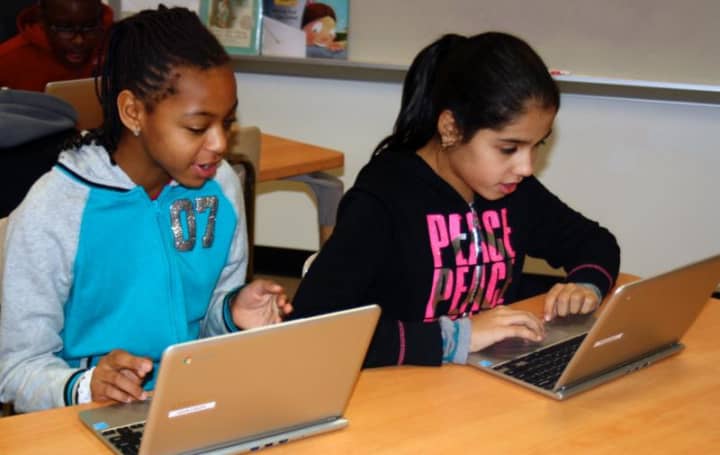 Students create code in the Grady library.