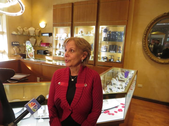 Virginia Shasha, a co-worker of Ellen Brody, talks to reporters at ICD Contemporary Jewelry in Chappaqua.