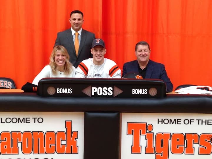 Alex Parkinson with his parents and coach Anthony Vitti. 
 