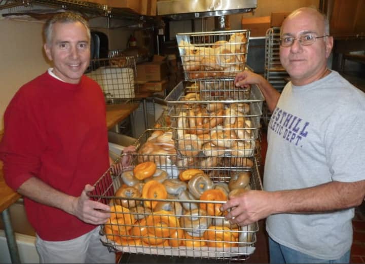 Anthony and Peter Telesco standing by bagels at their Liz-Sue bagel shop in Stamford.