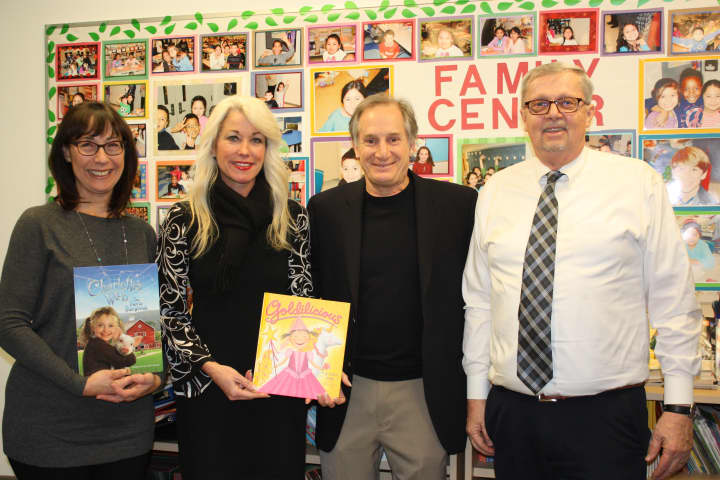 From left are, Sandy Rappaport, co-chair, Books2Connect; Heather Cavanagh, executive director, YWCA Darien/Norwalk; Ron Berler, consultant, Norwalk Public Schools; and David Hay, Brookside Elementary School Principal