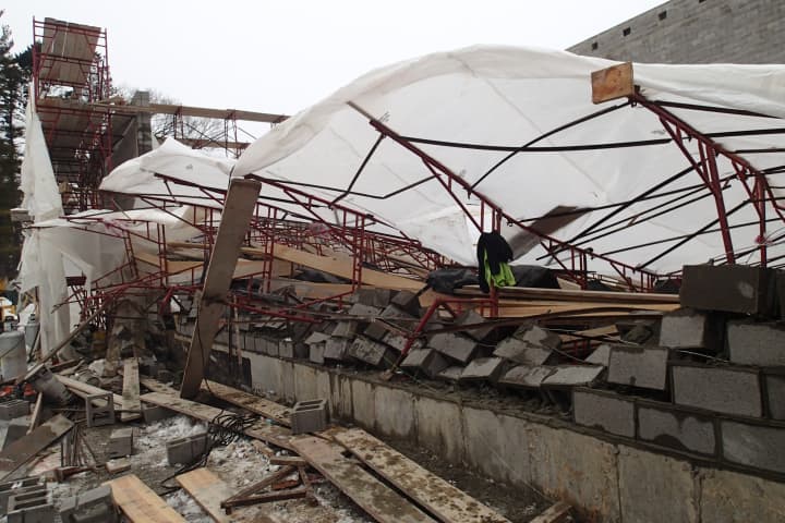 Three workers suffered non-life-threatening injuries when 100 feet of scaffolding collapsed at Greens Farms Academy in Westport Thursday.