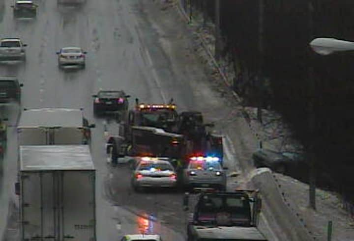 A spin-out blocks a lane of I-95 south near Mill Hill Road in Fairfield on Monday morning. 