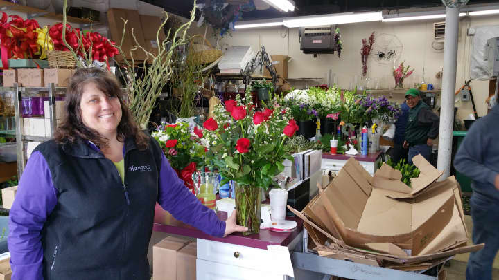 General manager Sandra Harris, gave the Daily Voice a sneak peek into the workings of Hansen&#x27;s Flower Shop. She is seen here with a bouquet of Valentine&#x27;s Day&#x27;s most popular flower, the red rose.