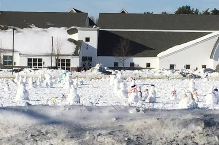 Third grade students at Samuel Staples Elementary School in Easton built 100 snowmen to reflect the 100 days of school.