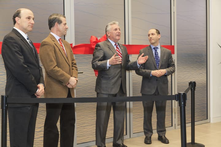 From left, at a ribbon cutting for Reproductive Medicine Associates of Connecticut are Dr. Spencer Richlin, Dr. Mark Leondires, Norwalk Mayor Harry Rilling and Dr. Joshua M. Hurwitz.