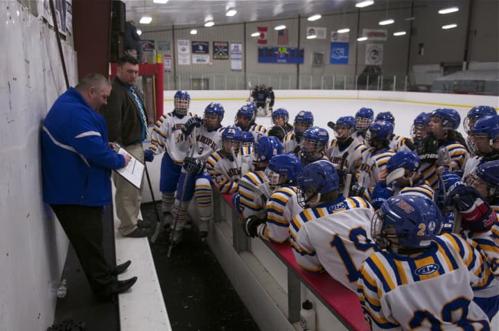 Mahopac coach Chris Lombardo instructs his team during timeout.