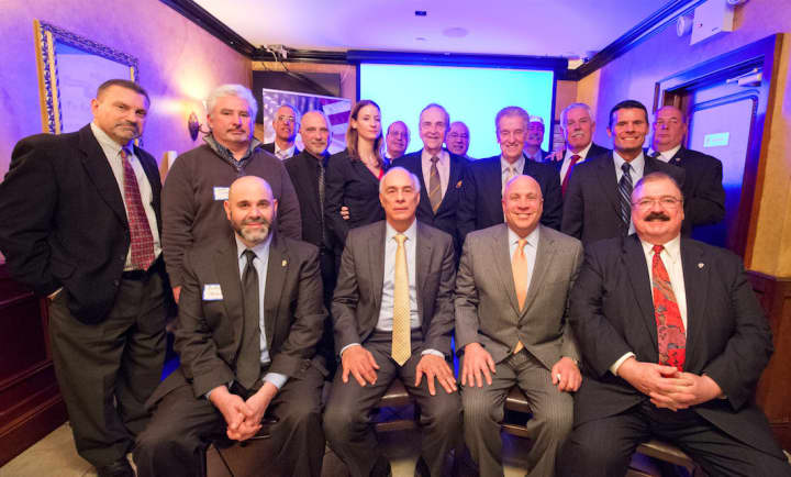 Gil Alba sitting front row center, accompanied by other board members of the Associated Licensed Detectives of New York State.