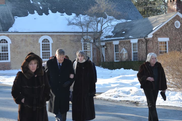 Attendees leave a memorial service held for Walter Liedtke at St. Matthew&#x27;s Episcopal Church in Bedford.